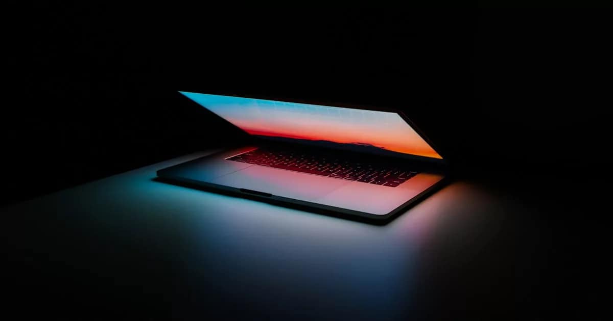 code on dark screen laptop